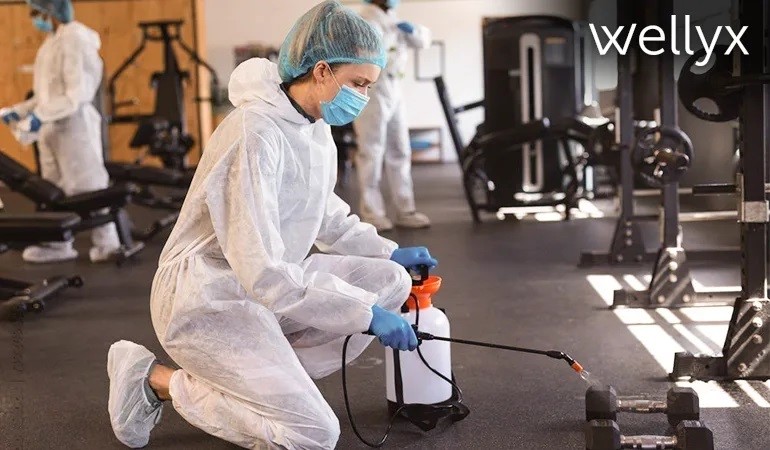 cleaning staff working in gym